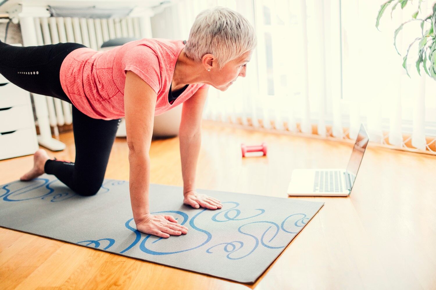 Woman doing yoga with a tablet.jpg